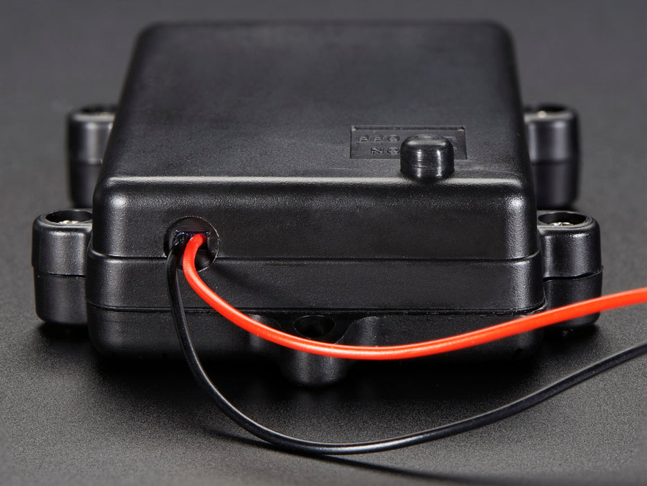 Angled shot of black 3 x AA waterproof battery holder with plain wires.