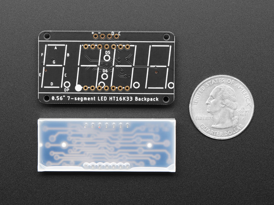 Yellow 7-segment clock display soldered to backpack with all segments lit