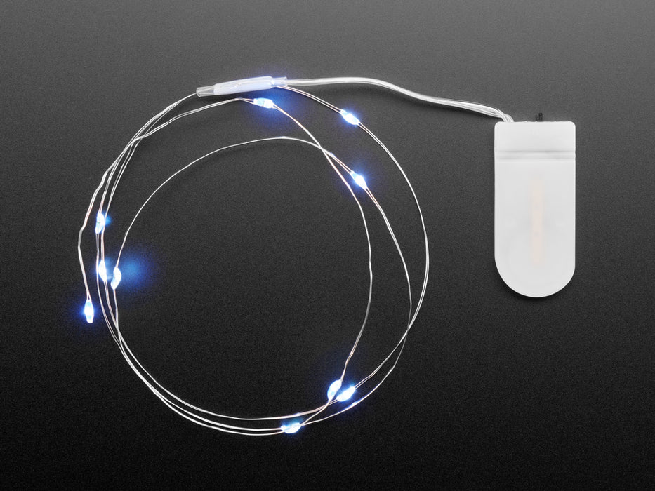 Lit coil of thin flexible wire with embedded LED 'fairy' lights attached to battery holder