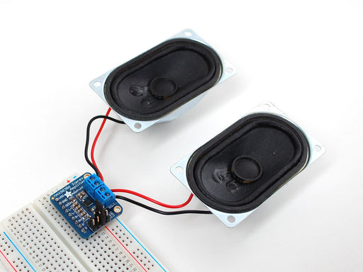 Top down view of a Stereo 3.7W Class D Audio Amplifier surrounded by different kinds of pins. 