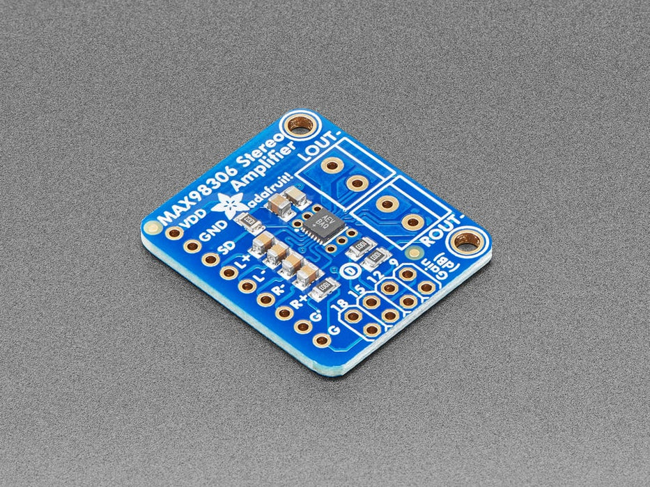 Top down view of a Stereo 3.7W Class D Audio Amplifier surrounded by different kinds of pins. 