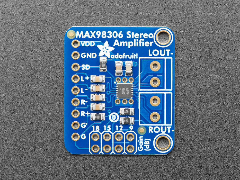 Top down view of a Stereo 3.7W Class D Audio Amplifier surrounded by different kinds of pins. 